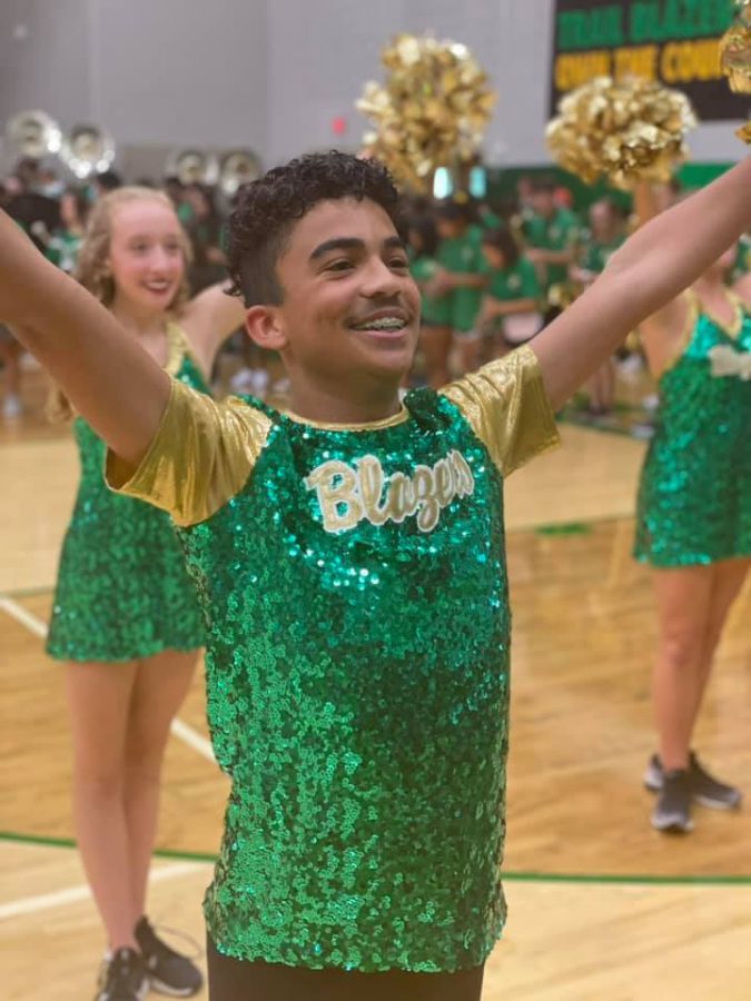 Jaylon Reed dances at a pep rally with Emerald Elite. Courtesy of Jamie Harmon. 