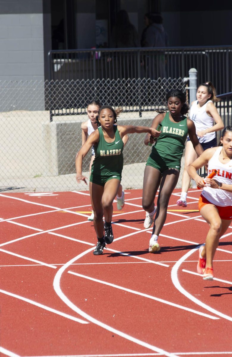LT Girls Track Races in a Relay. 
Credits: Mia Roberson 